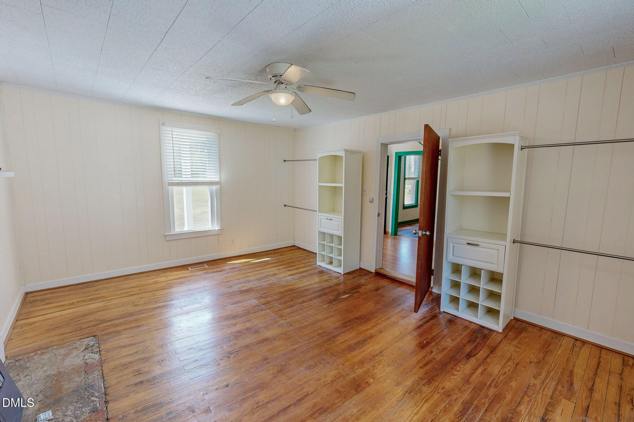1001 Charlie Reade Road Timberlake, NC 27583 - Photo 29 of 64 a view of an empty room with window and wooden floor