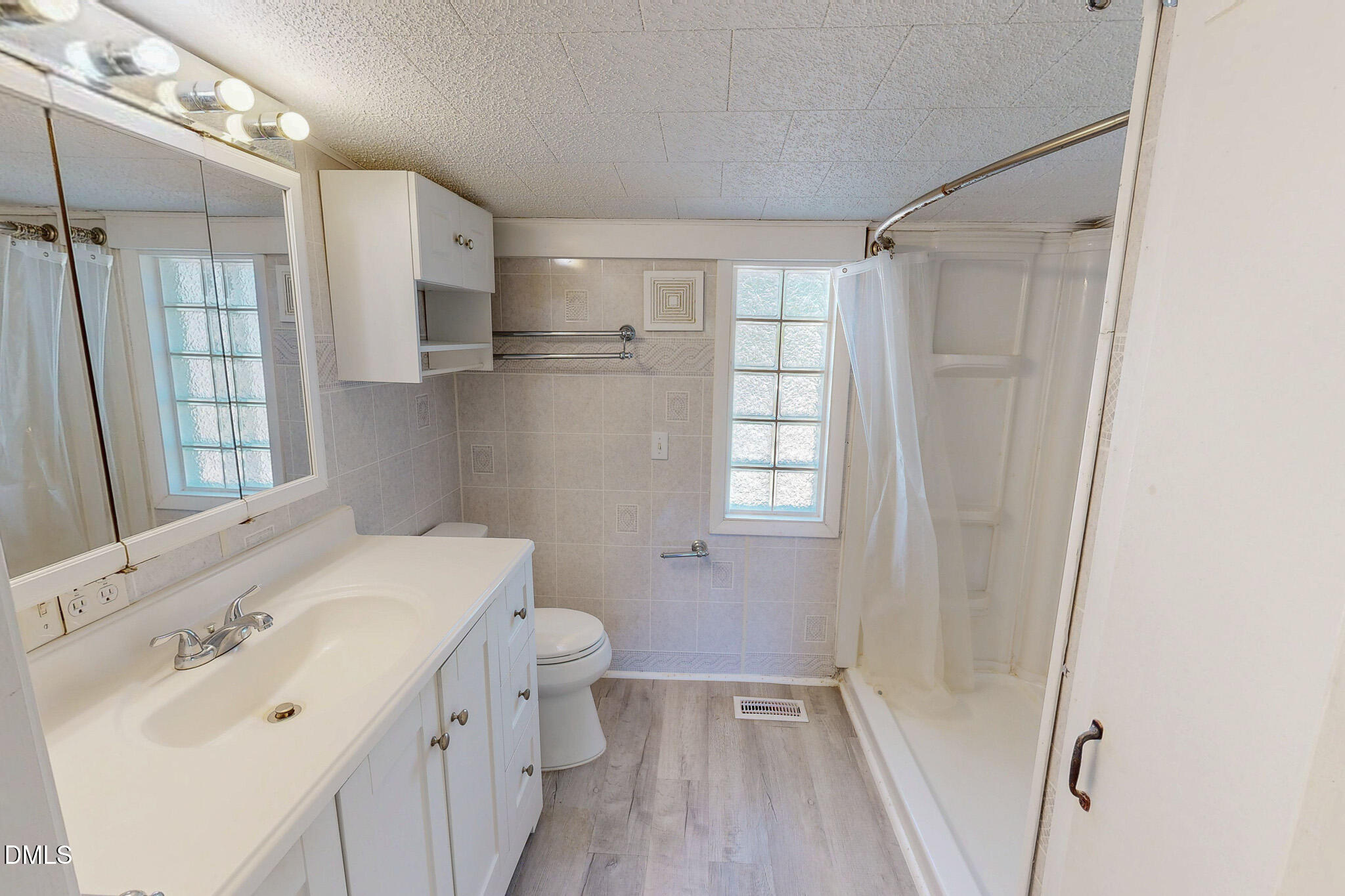 1001 Charlie Reade Road Timberlake, NC 27583 - Photo 37 of 64 a bathroom with a sink a toilet and shower