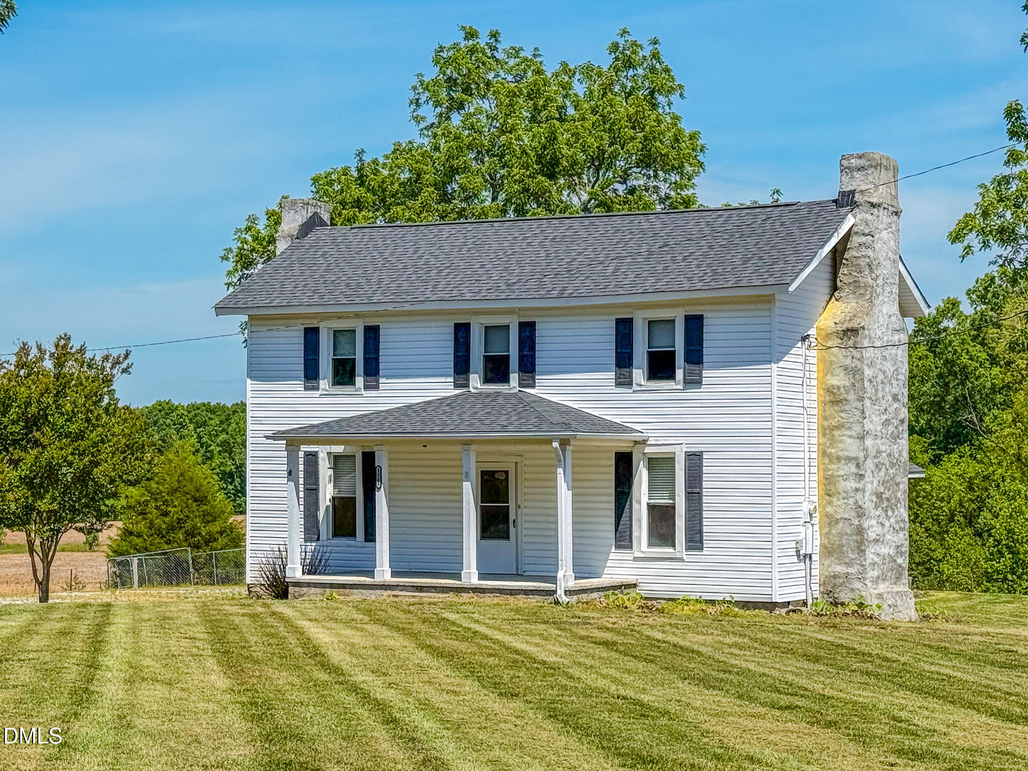 1001 Charlie Reade Road Timberlake, NC 27583 - Photo 59 of 64 a front view of a house with a garden