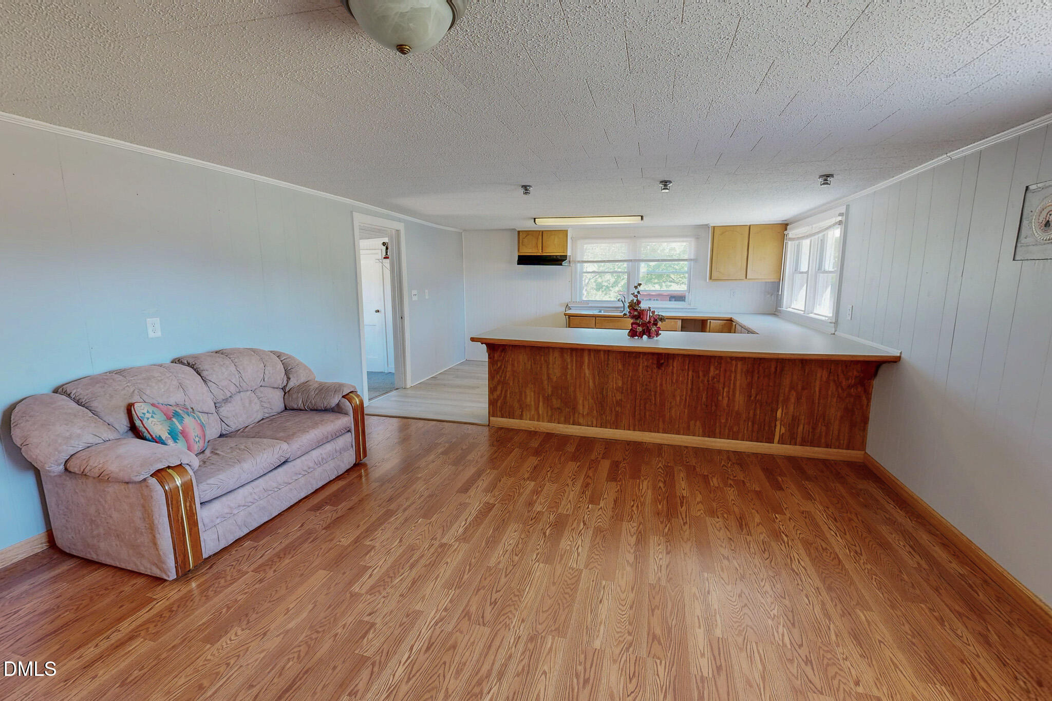 1001 Charlie Reade Road Timberlake, NC 27583 - Photo 9 of 64 a living room with furniture and a wooden floor