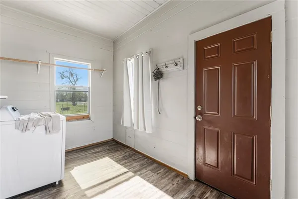 a view of a house with a yard and tree s