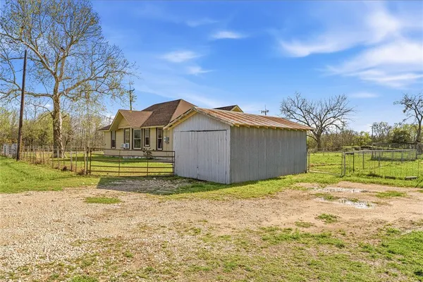 a view of a backyard of the house