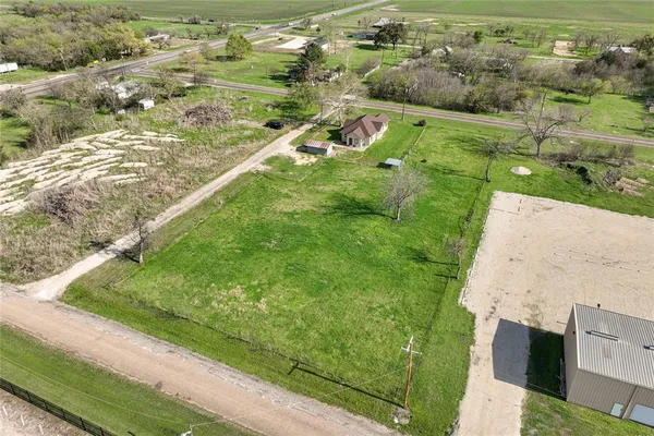 front view of a house with a garden