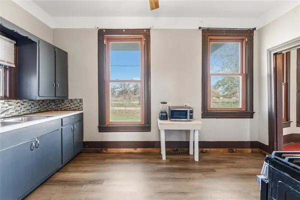 a kitchen with stainless steel appliances granite countertop a stove and a refrigerator