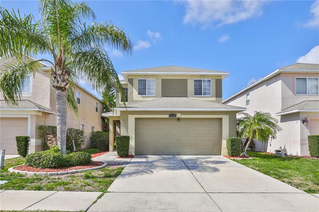 12926 Fennway Ridge Drive Riverview, FL 33579 - Photo 1 of 1 a front view of a house with a yard and garage