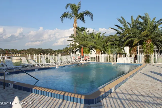 a view of a swimming pool with a terrace