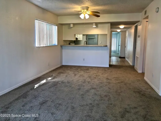 a view of a kitchen with a sink and cabinet area