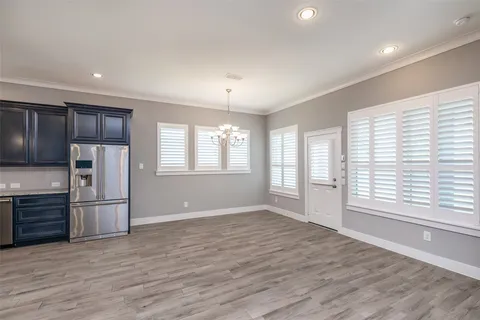 a view of a kitchen with a stove cabinets and wooden floor