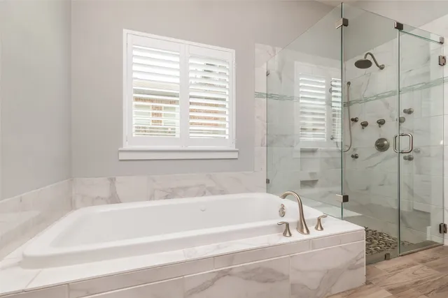 a white bath tub sitting next to a white sink