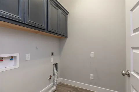 a view of storage and utility room with washer and dryer