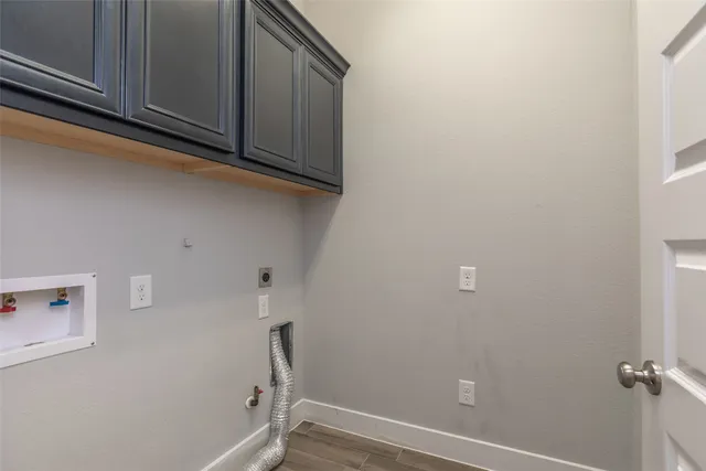 a view of storage and utility room with washer and dryer
