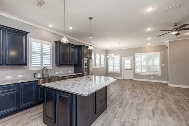 a view of an empty room and window with wooden floor