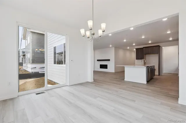 a view of a kitchen with a sink and a kitchen counter top