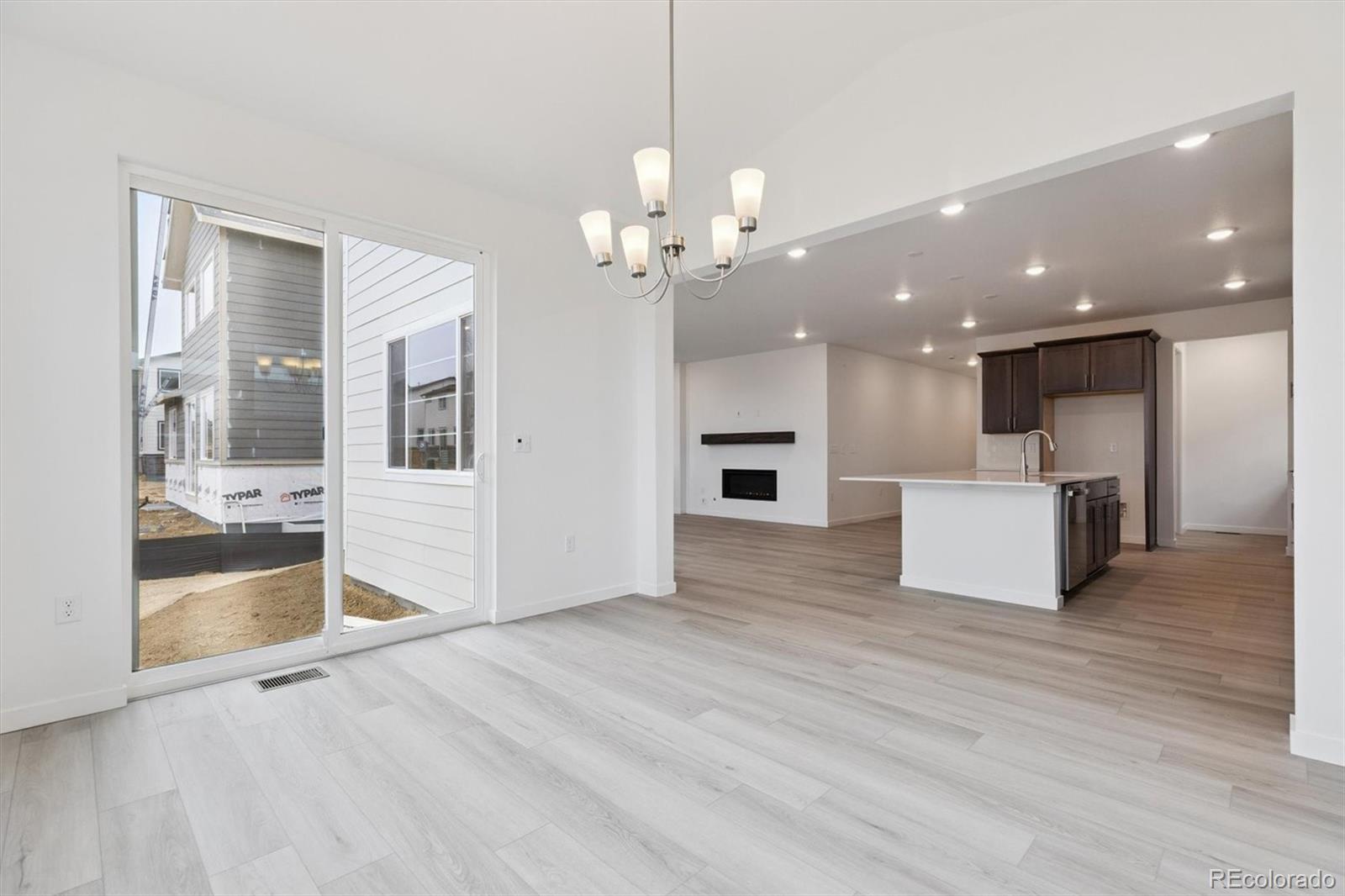 2144 South Ider Way Aurora, CO 80018 - Photo 14 of 27 a view of a kitchen with a sink and a kitchen counter top