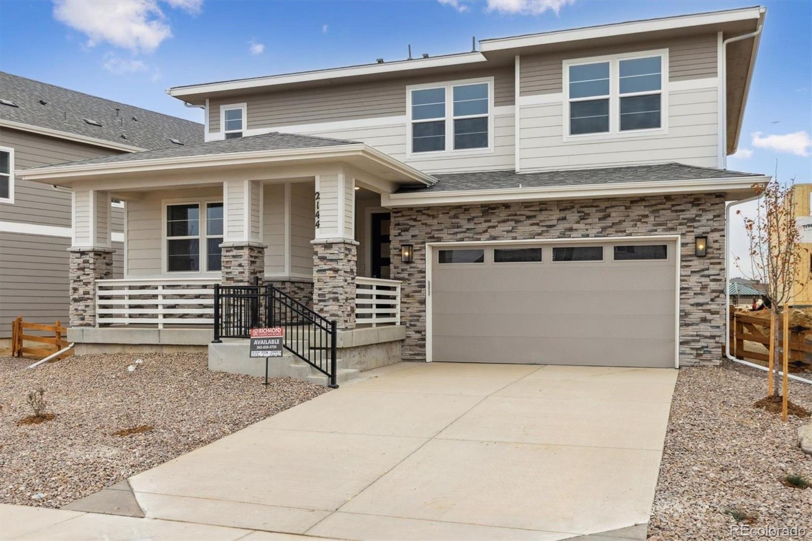 2144 South Ider Way Aurora, CO 80018 - Photo 2 of 27 a view of house with chair and wooden fence