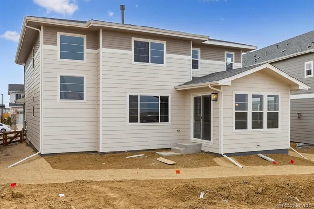 a view of front of house with a yard