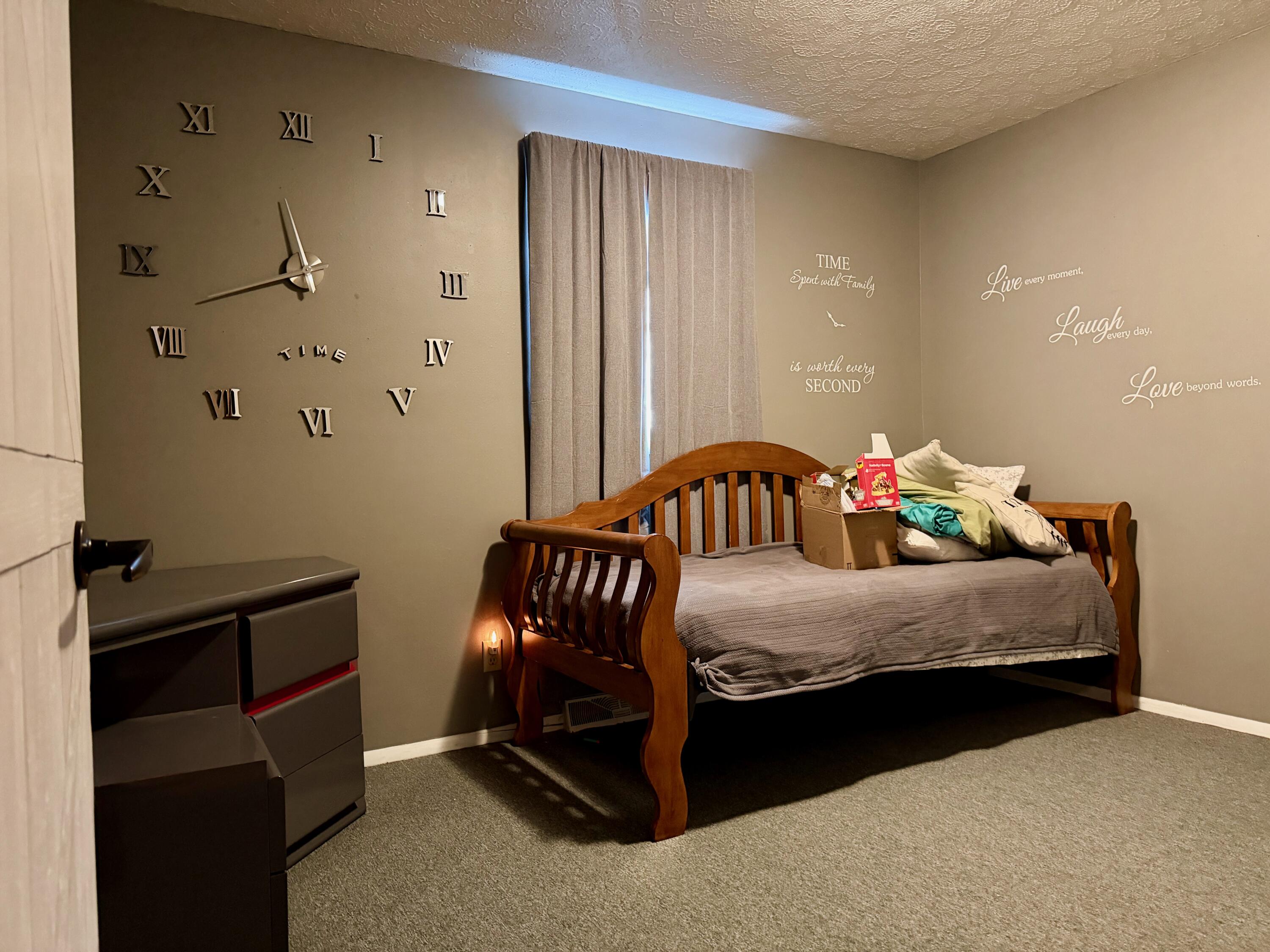 402 East St Louis Street Knox, IN 46534 - Photo 11 of 19 a bedroom with a bed and a window