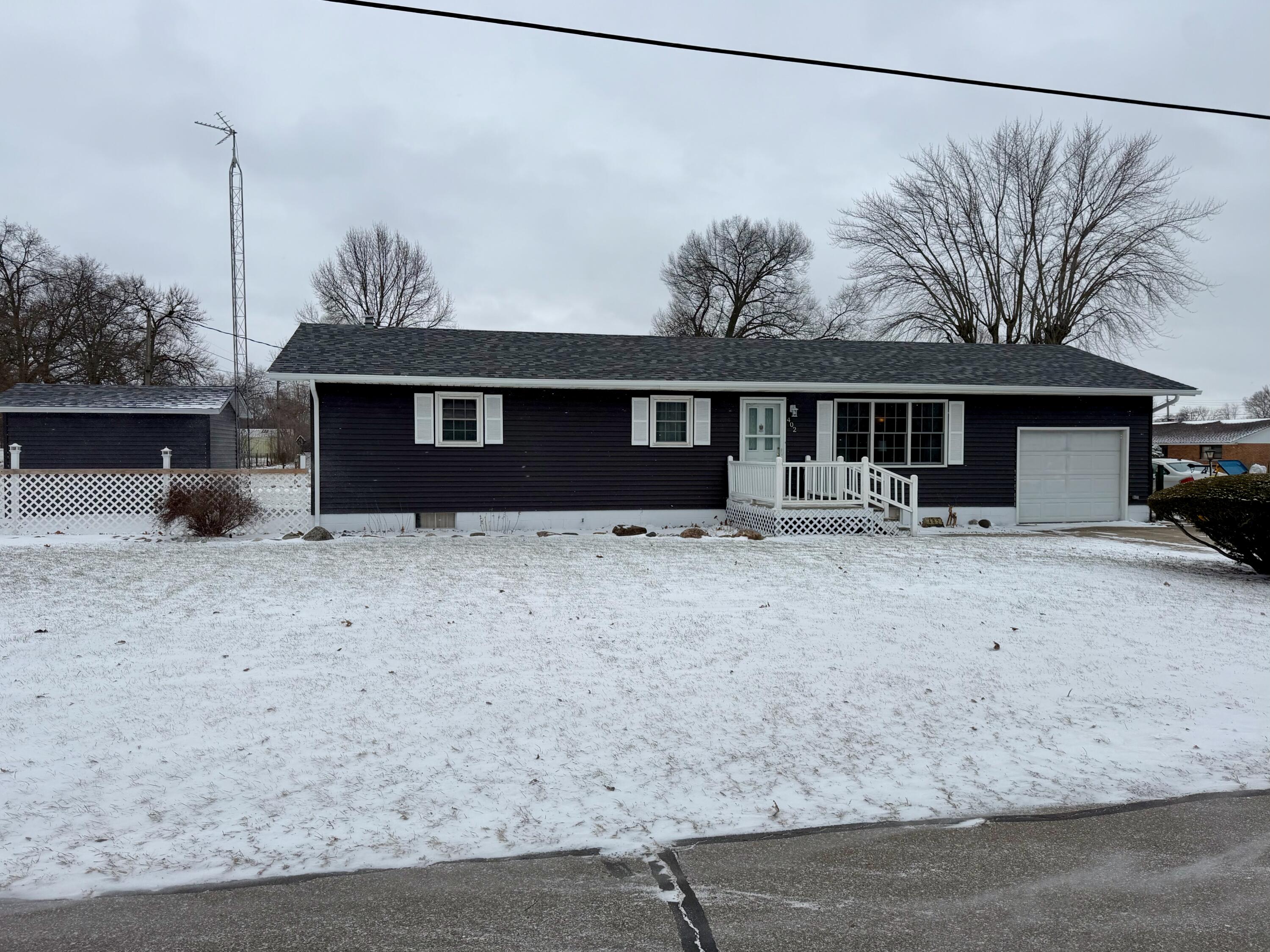 402 East St Louis Street Knox, IN 46534 - Photo 18 of 19 a front view of a house with a yard and garage