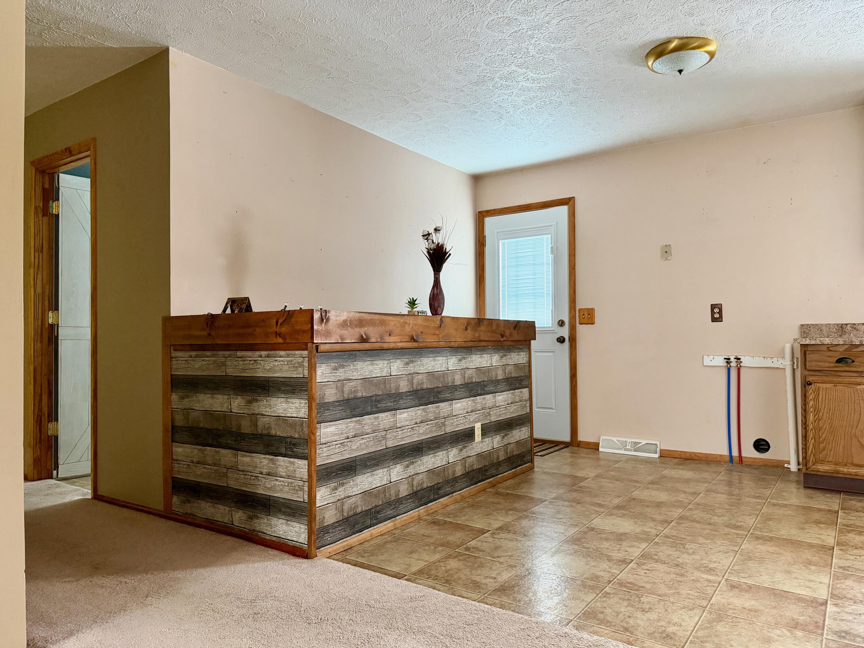 402 East St Louis Street Knox, IN 46534 - Photo 8 of 19 a view of room with wooden floor