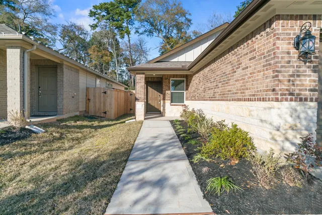a view of a pathway along the house