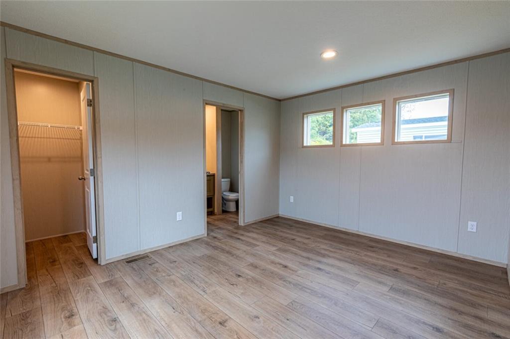 1408 A Hidden Valley Road Bulger, PA 15019 - Photo 11 of 22 an empty room with wooden floor and windows