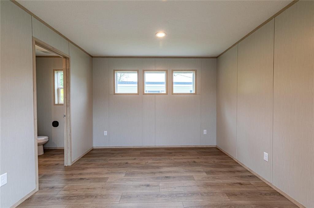 1408 A Hidden Valley Road Bulger, PA 15019 - Photo 12 of 22 wooden floor in an empty room with a window