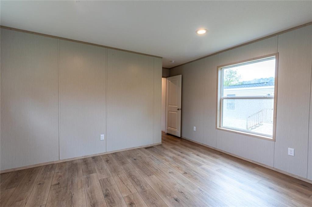 1408 A Hidden Valley Road Bulger, PA 15019 - Photo 14 of 22 an empty room with wooden floor and windows