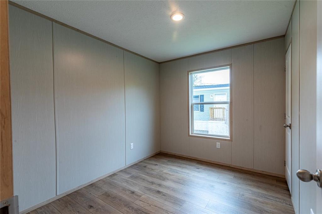 1408 A Hidden Valley Road Bulger, PA 15019 - Photo 17 of 22 an empty room with wooden floor and windows
