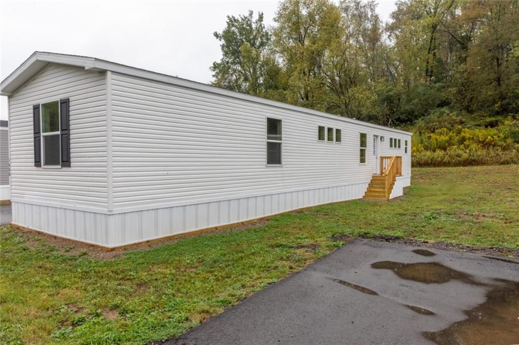 1408 A Hidden Valley Road Bulger, PA 15019 - Photo 2 of 22 a view of a backyard with plants and large tree