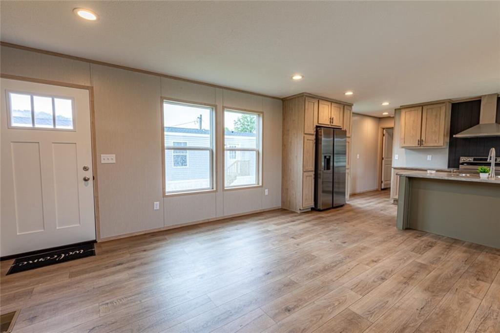 1408 A Hidden Valley Road Bulger, PA 15019 - Photo 4 of 22 a view of a kitchen with refrigerator and wooden floor
