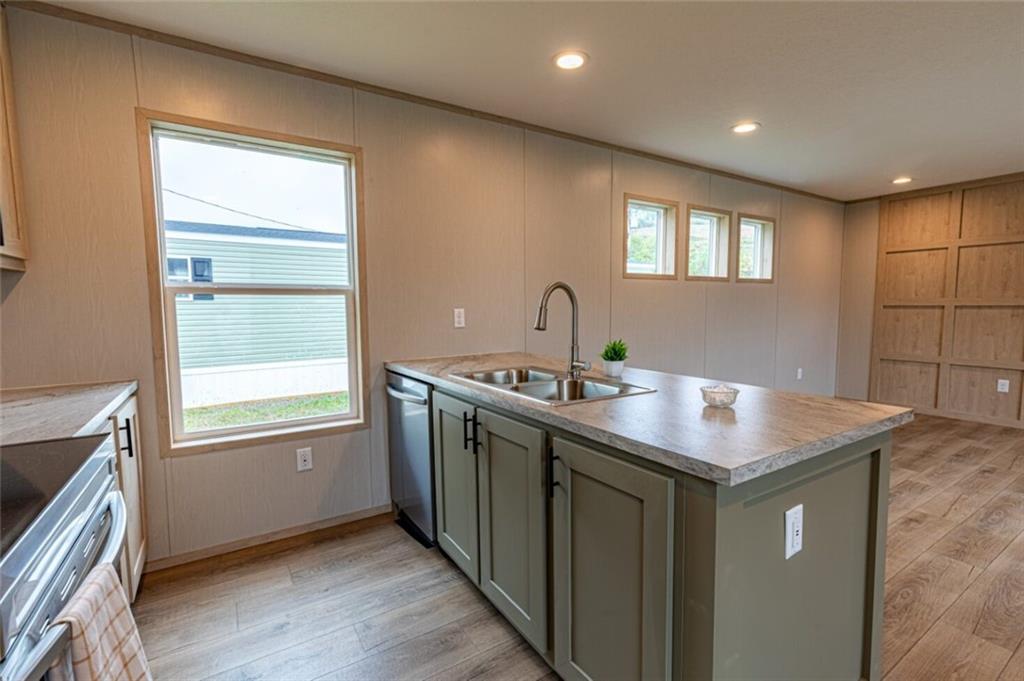 1408 A Hidden Valley Road Bulger, PA 15019 - Photo 7 of 22 a kitchen with stainless steel appliances granite countertop a sink and a window