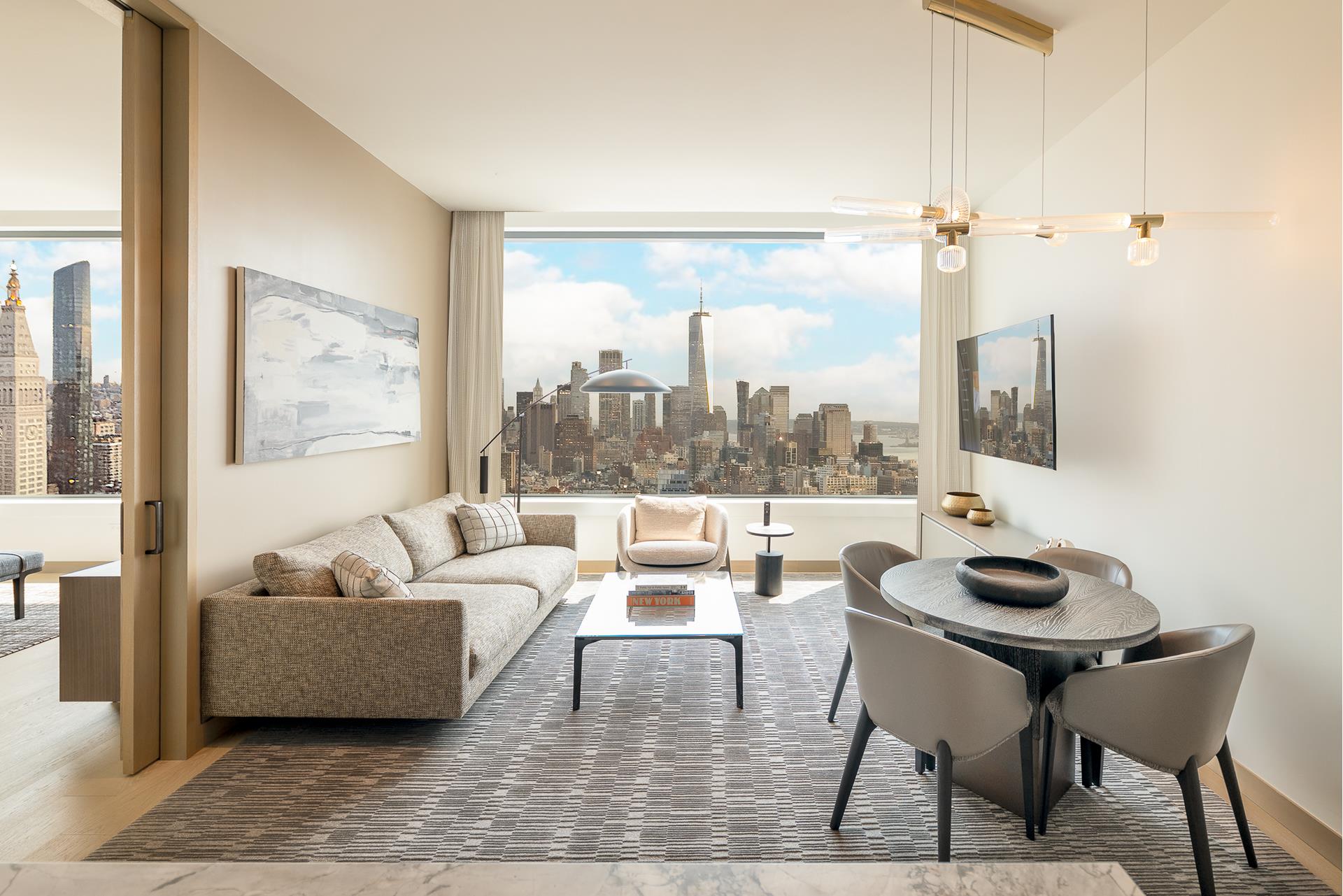 a living room with furniture and a floor to ceiling window