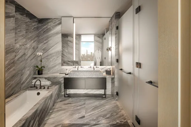 a bathroom with a sink and mirror