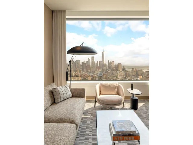 a picture of a room with a door and a large window