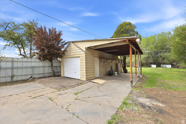676 South 500 West Provo, UT 84601 - Photo 24 of 29 Garage featuring concrete driveway