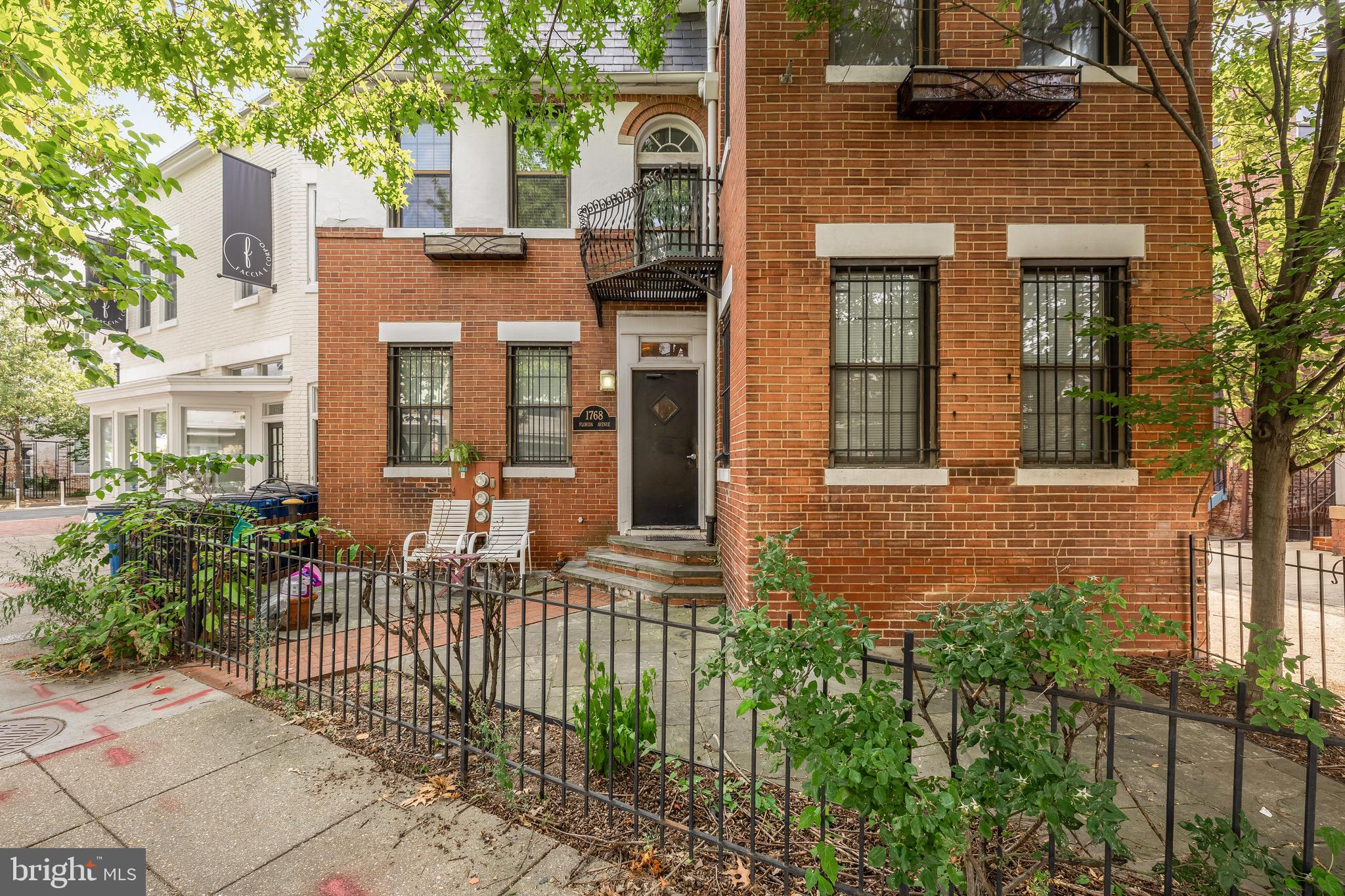 1768 Florida Avenue Northwest, Unit 1 Washington, DC 20009 - Photo 1 of 18 a front view of a house with a garden