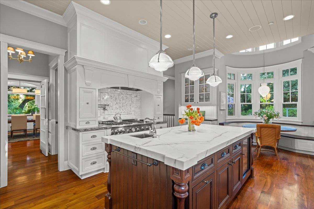 3510 Alpine Road Portola Valley, CA 94028 - Photo 15 of 77 a kitchen with a stove and wooden floor