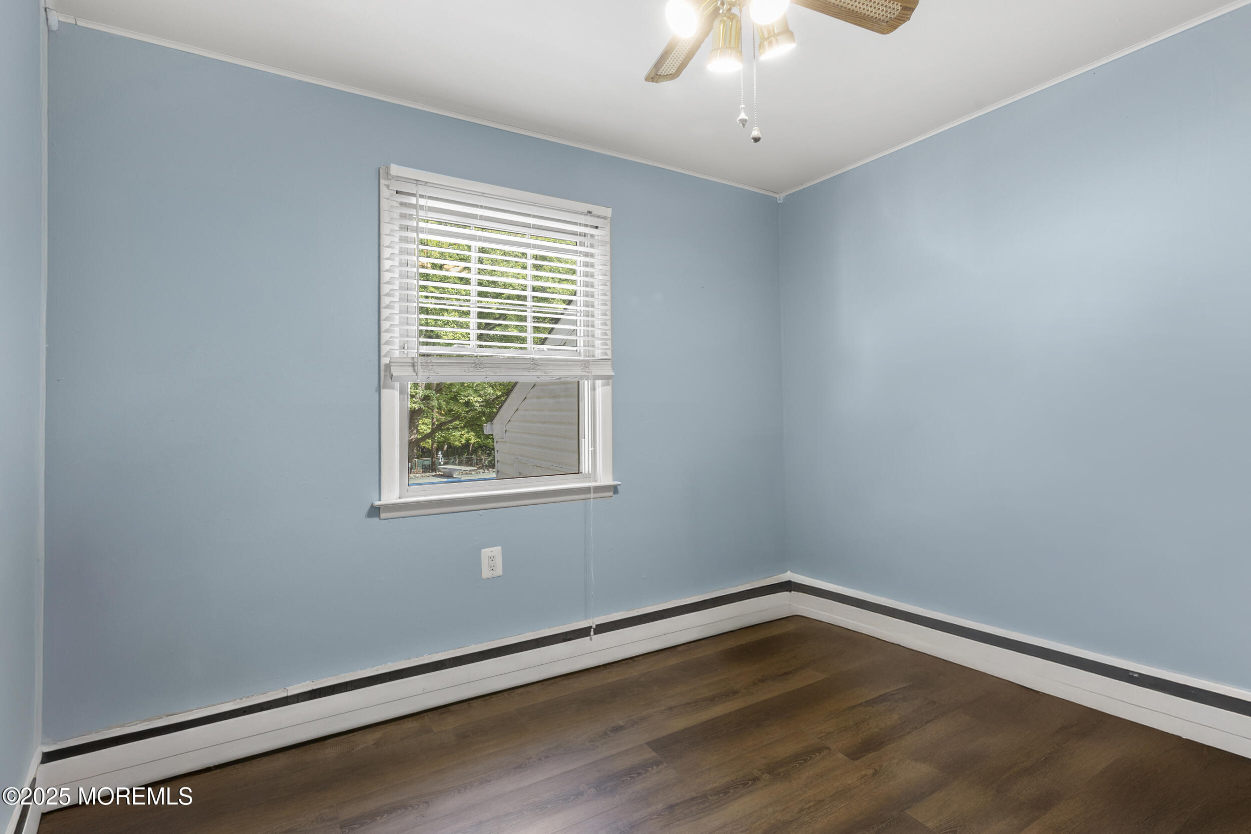 742 West Commodore Boulevard Jackson, NJ 08527 - Photo 15 of 37 a view of an empty room with wooden floor and a window