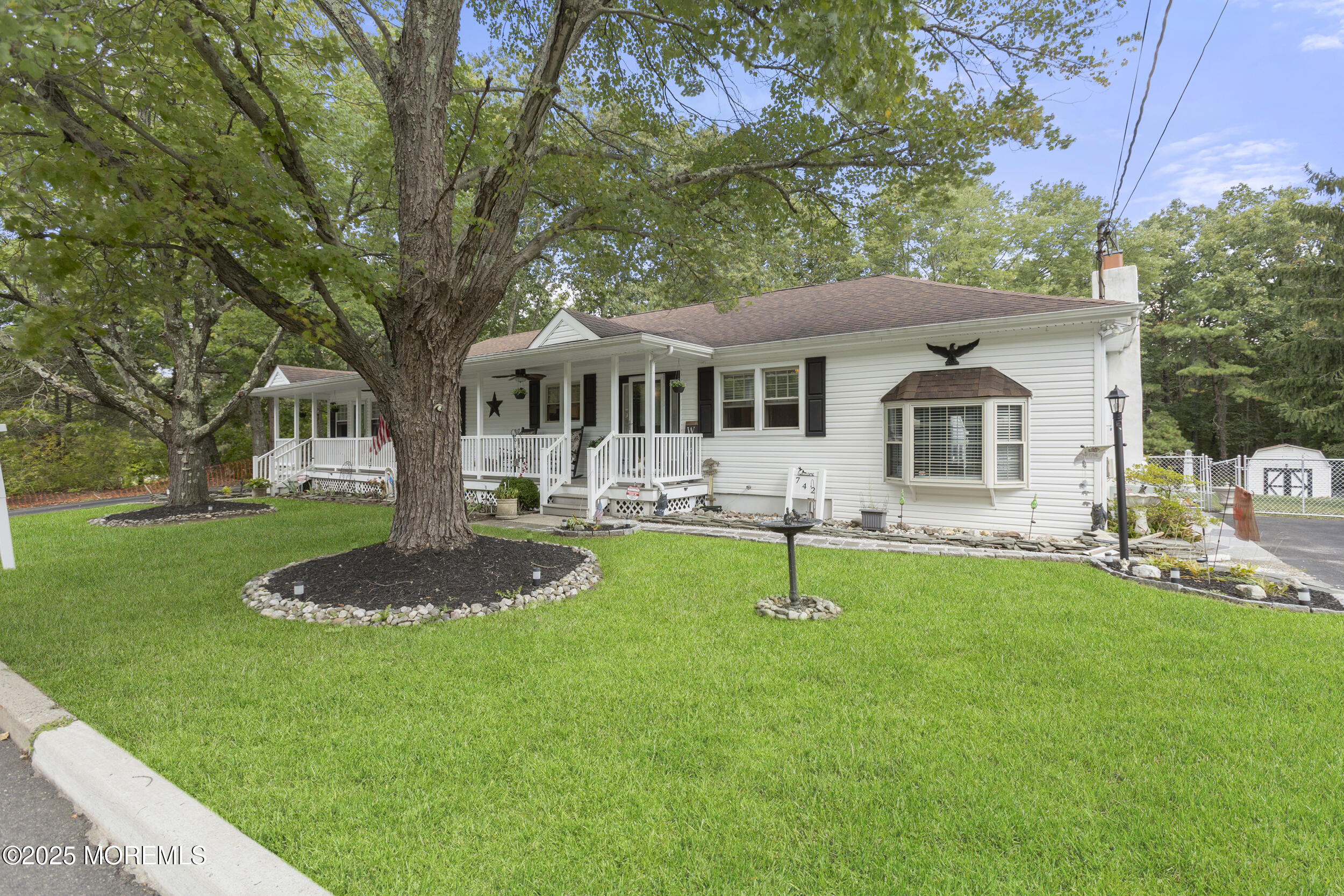 742 West Commodore Boulevard Jackson, NJ 08527 - Photo 2 of 37 a front view of a house with a yard