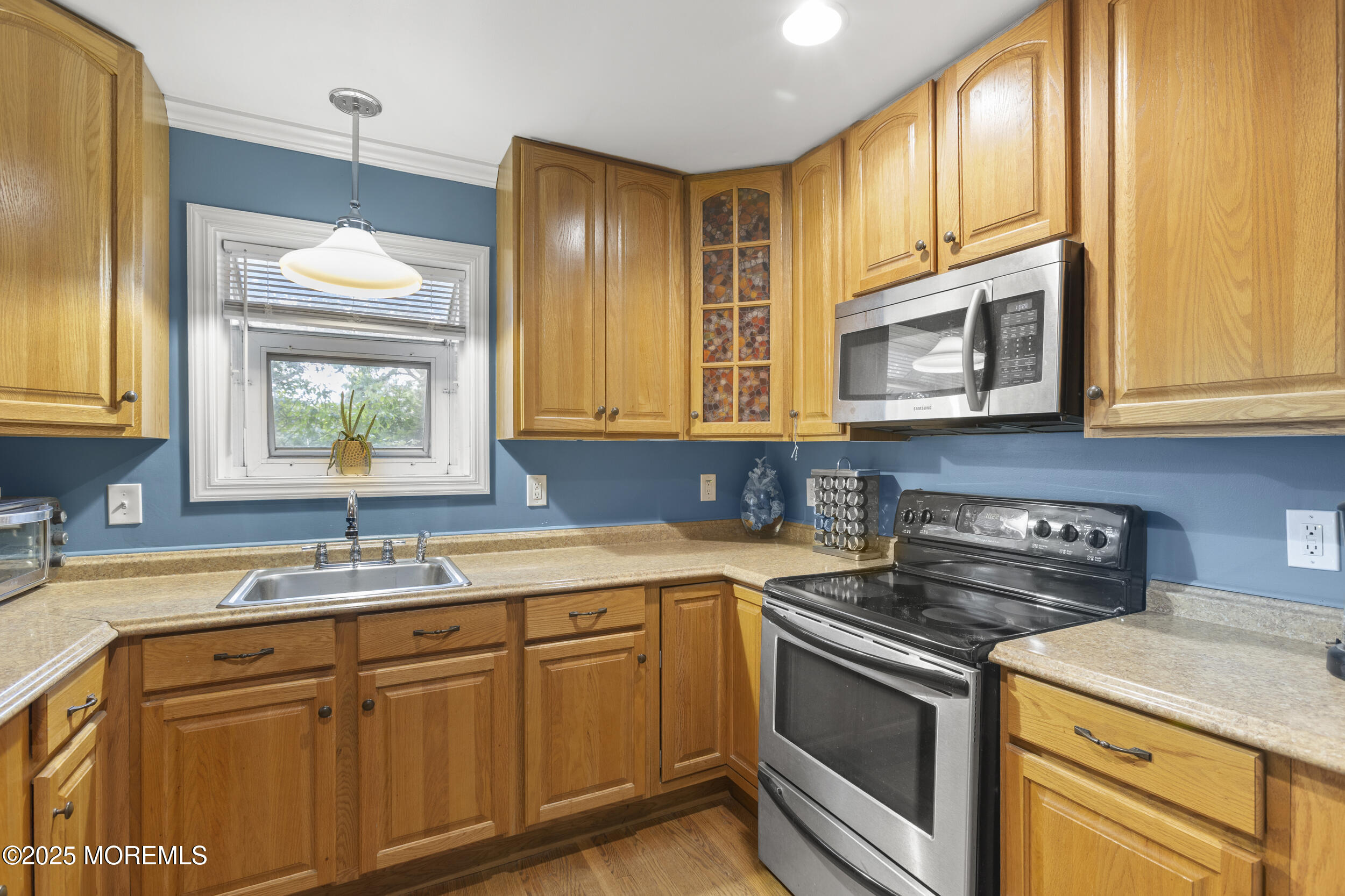 742 West Commodore Boulevard Jackson, NJ 08527 - Photo 22 of 37 a kitchen with stainless steel appliances granite countertop a sink stove and microwave