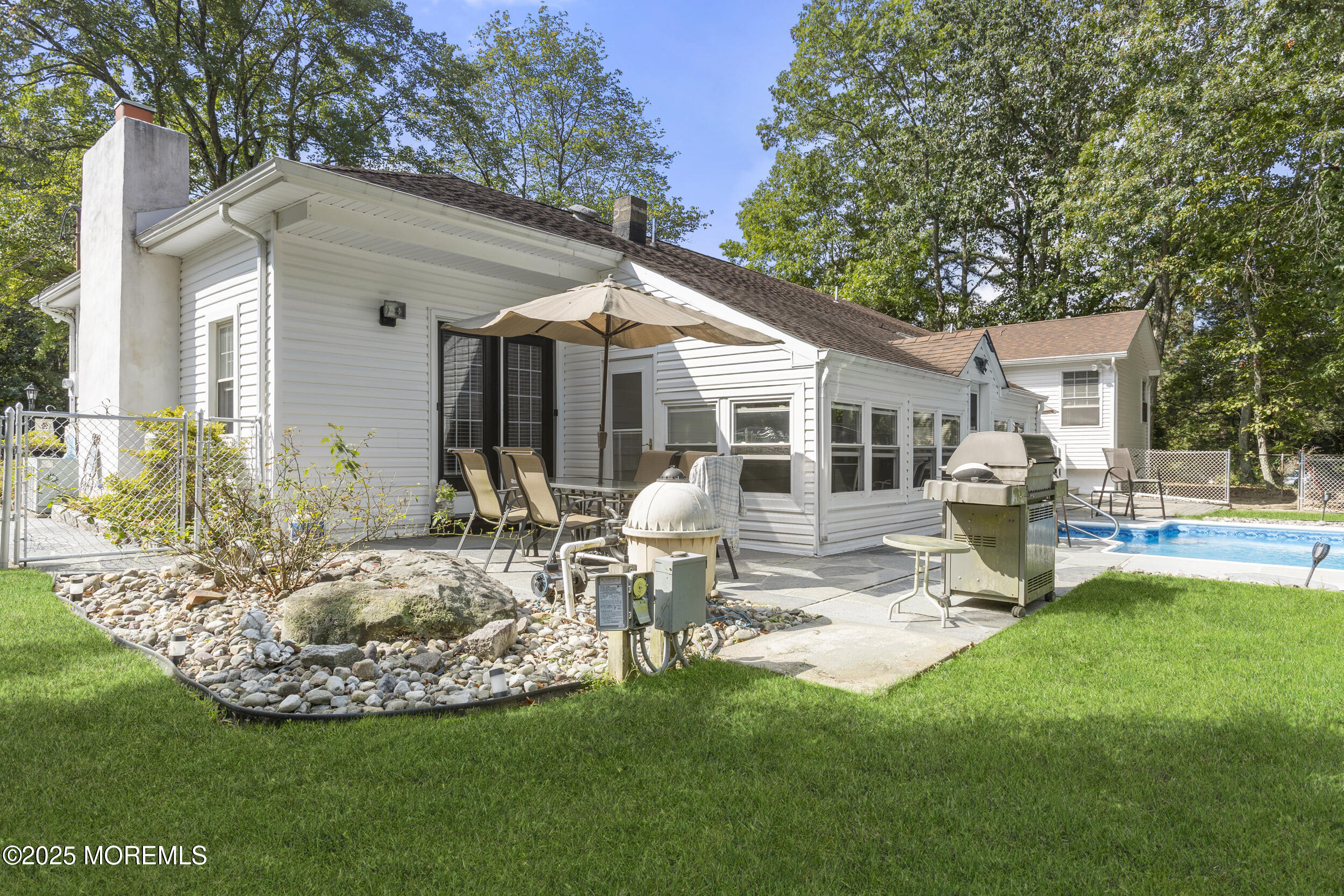 742 West Commodore Boulevard Jackson, NJ 08527 - Photo 28 of 37 a front view of house with yard and outdoor seating