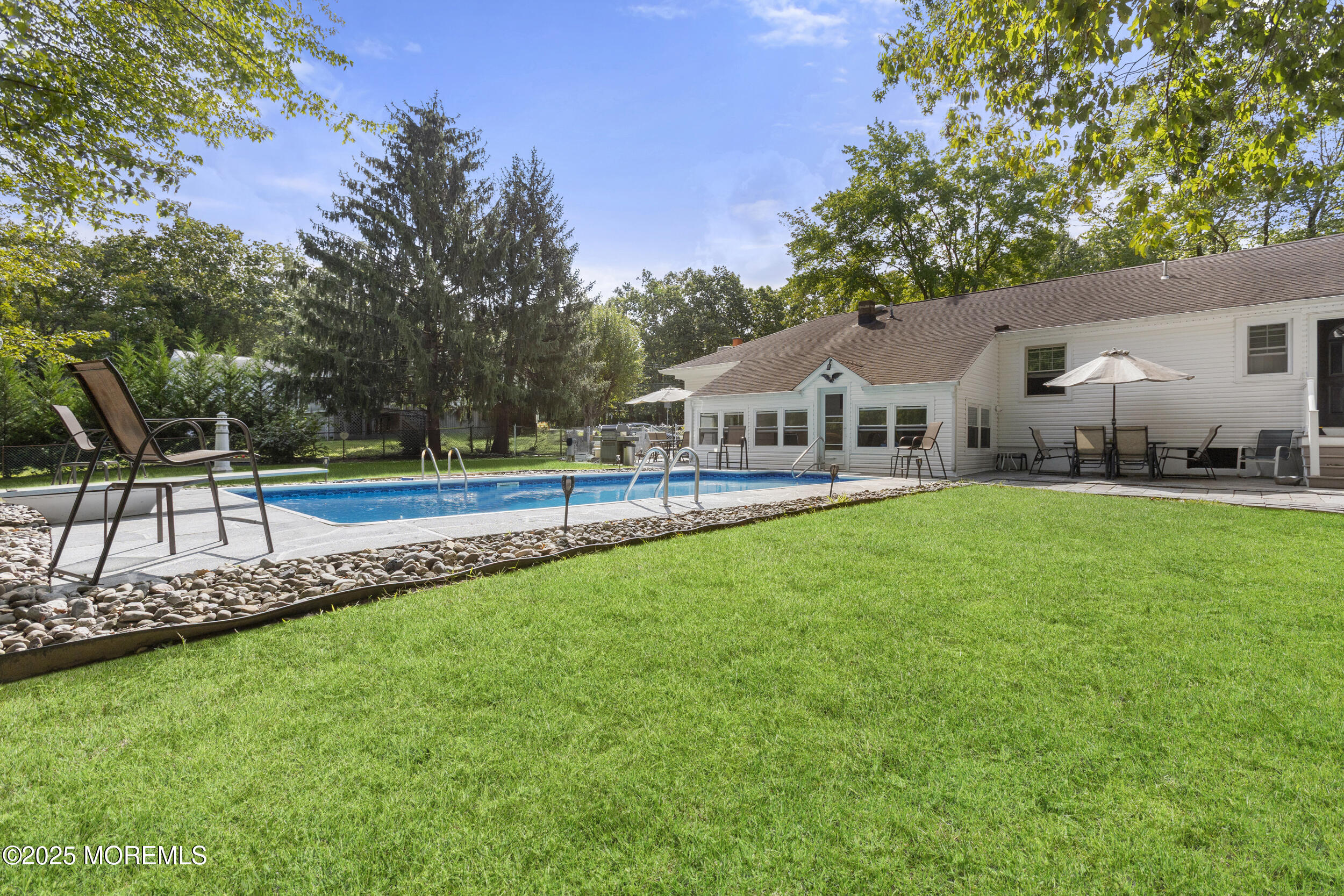 742 West Commodore Boulevard Jackson, NJ 08527 - Photo 31 of 37 a house view with swimming pool and green space