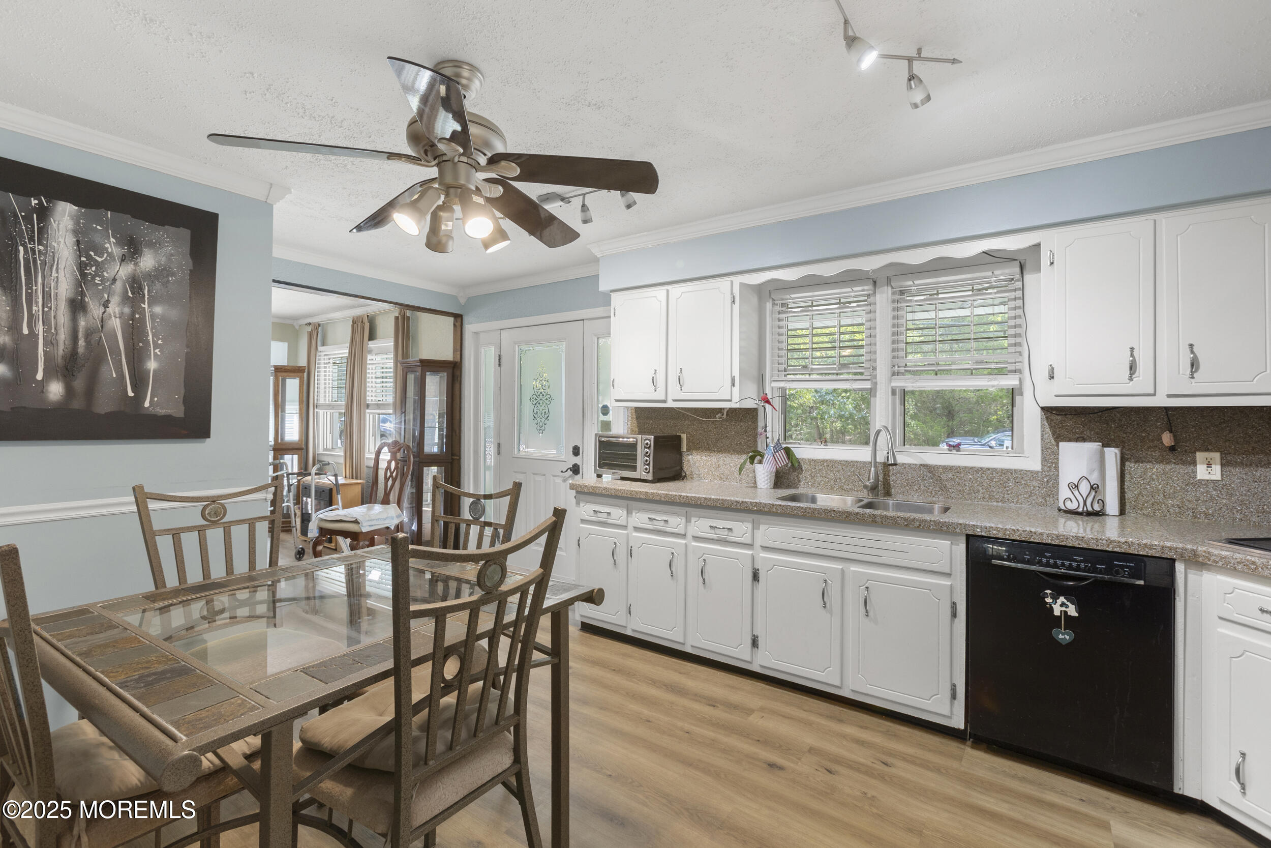 742 West Commodore Boulevard Jackson, NJ 08527 - Photo 5 of 37 a kitchen with granite countertop a dining table chairs cabinets and stainless steel appliances