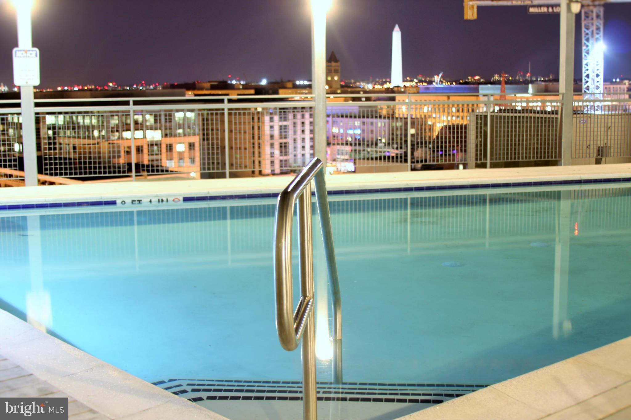 555 Massachusetts Avenue Northwest, Unit 806 Washington, DC 20001 - Photo 16 of 22 a view of a lake from a balcony