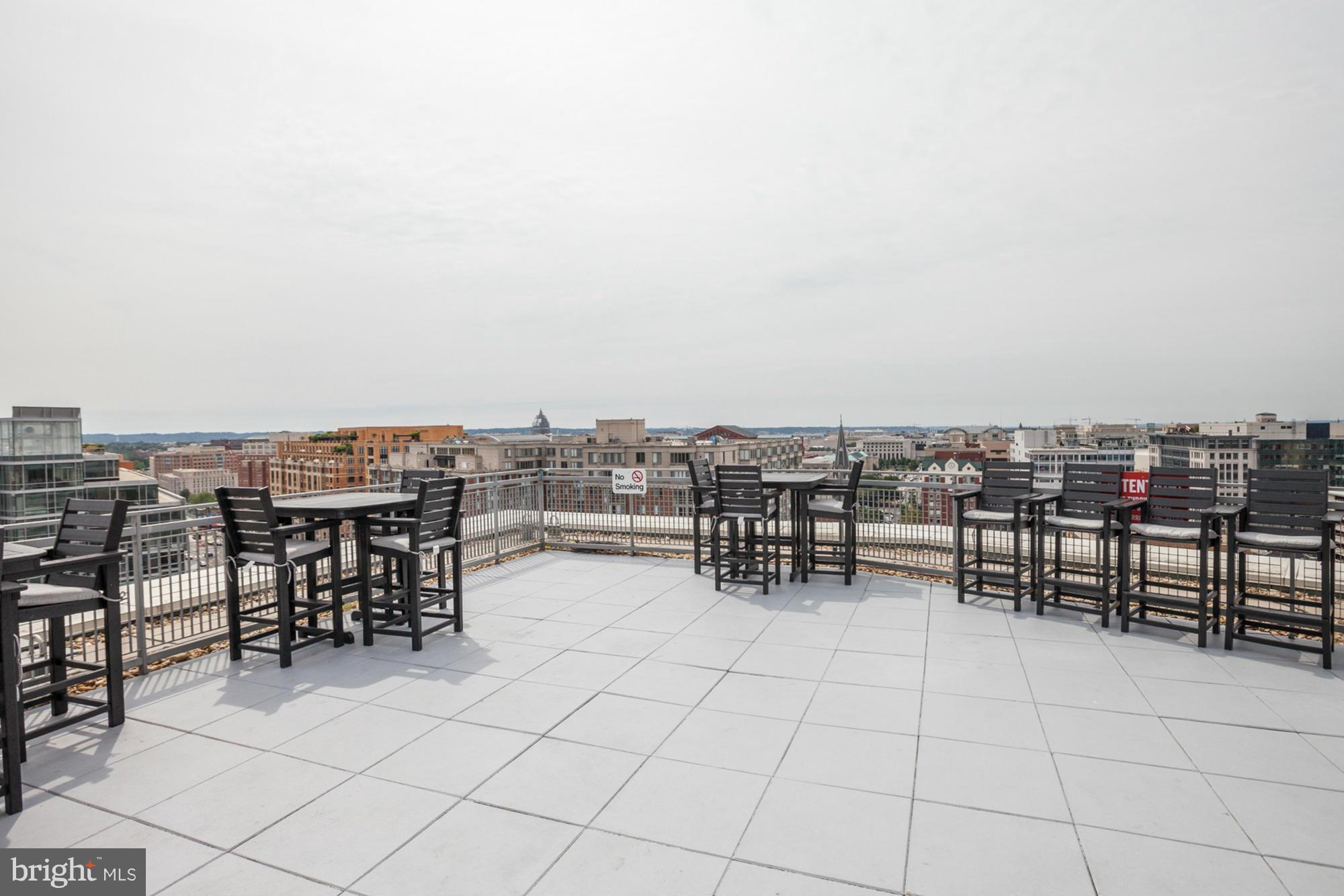 555 Massachusetts Avenue Northwest, Unit 806 Washington, DC 20001 - Photo 19 of 22 a view of a terrace with chairs
