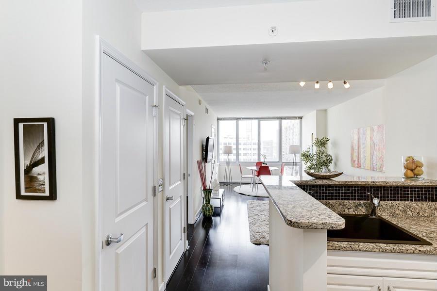555 Massachusetts Avenue Northwest, Unit 806 Washington, DC 20001 - Photo 2 of 22 a living room with furniture and a table