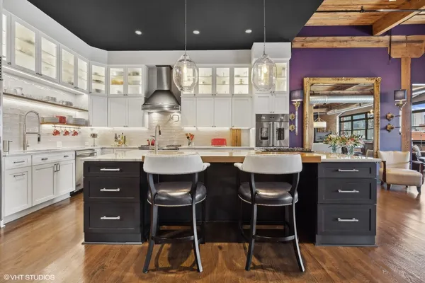 a kitchen with a sink cabinets and window