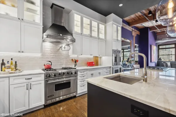 a kitchen with a stove and a sink
