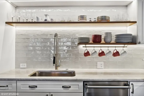 a close view of sink and cabinets