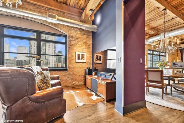a balcony with furniture and a window